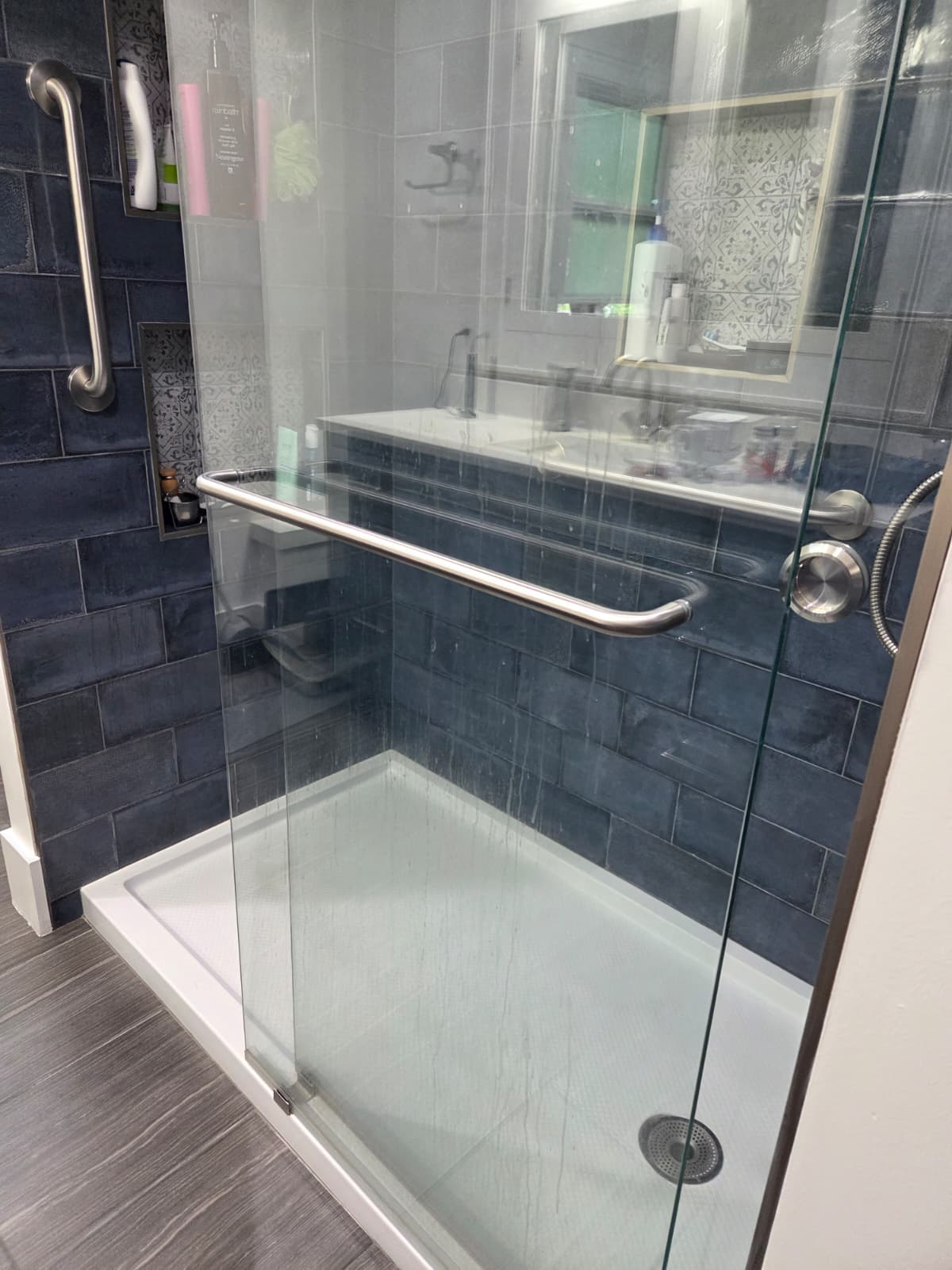 Shower with water spots before Serve cleaning