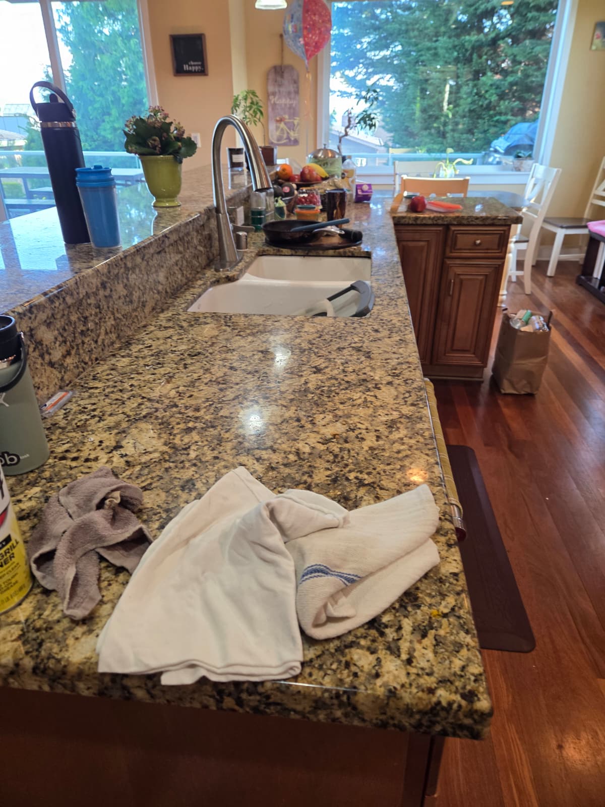 Cluttered kitchen counter before Serve cleaning
